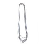 long grey rubber necklace on a white background