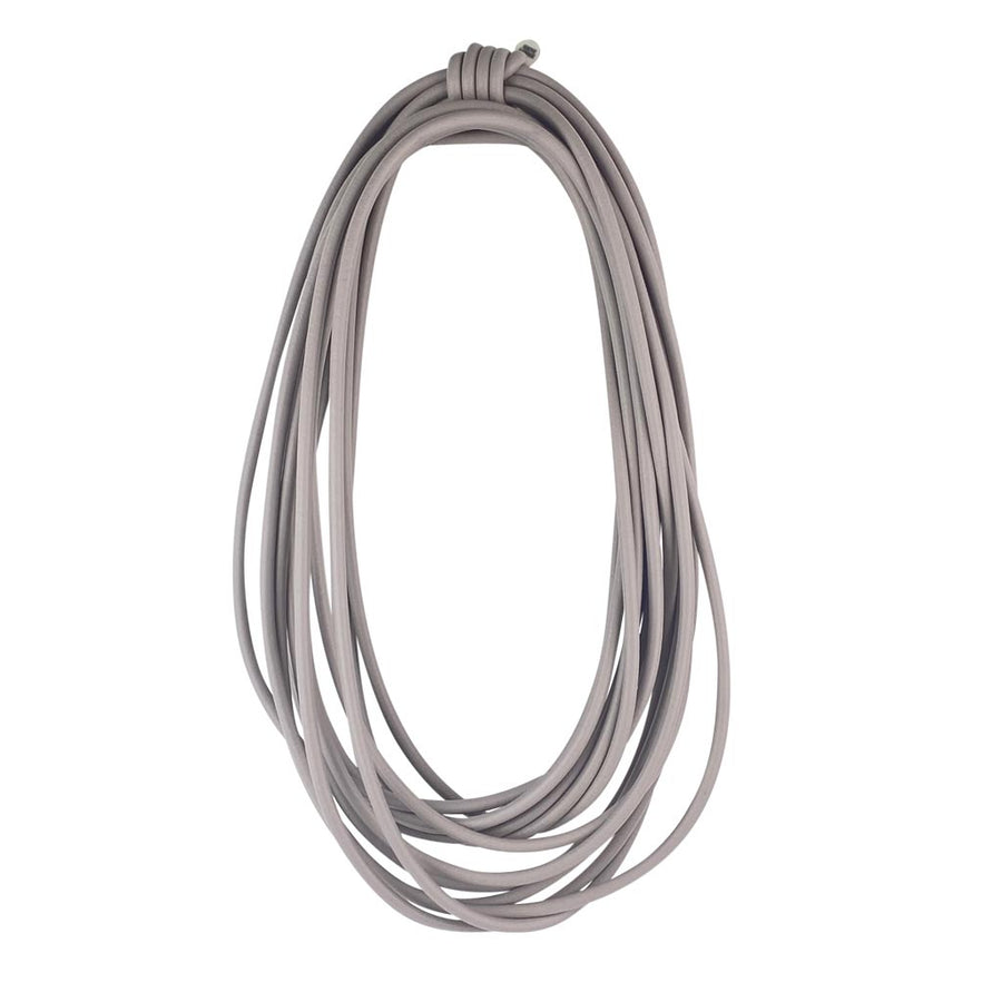 long grey rubber necklace on a white background