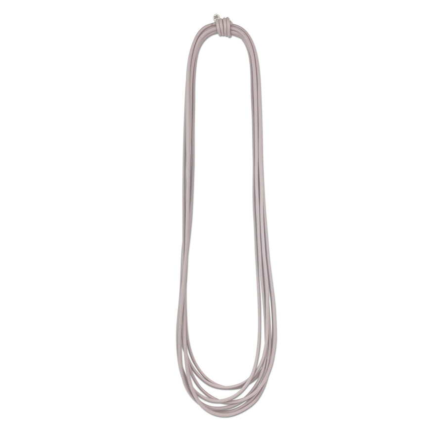 long grey rubber necklace on a white background