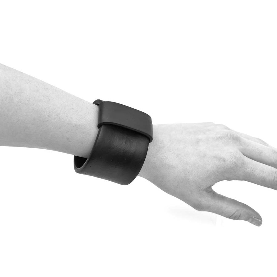 wide black bangle on an arm mannequin
