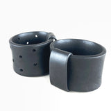 wide rubber bangles on a white background