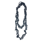 Edgy, long tangled black rubber necklace.