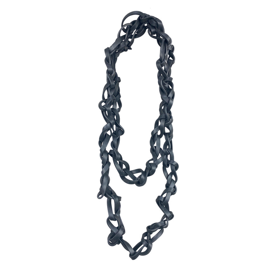 Edgy, long tangled black rubber necklace.