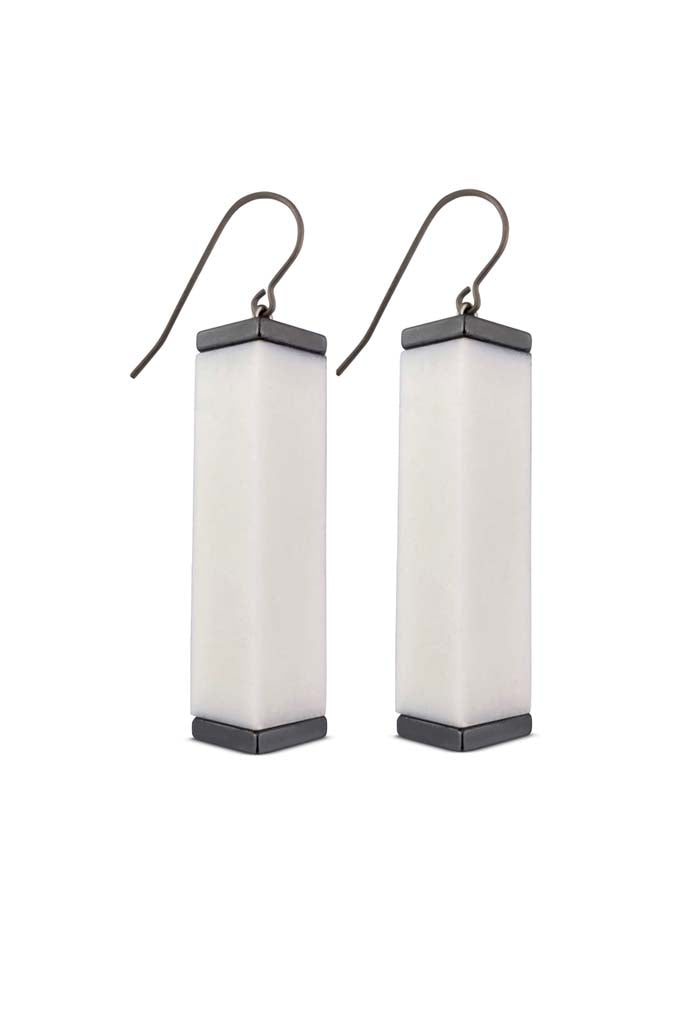 white tower earrings on a white background