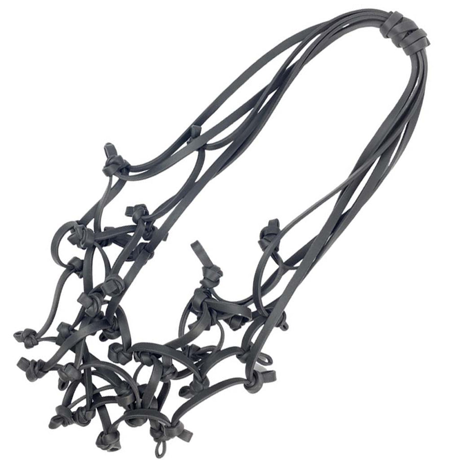 black knotted rubber necklace on a white background
