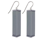 grey tower earrings  on a white background
