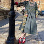 woman wearing a long grey rubber necklace