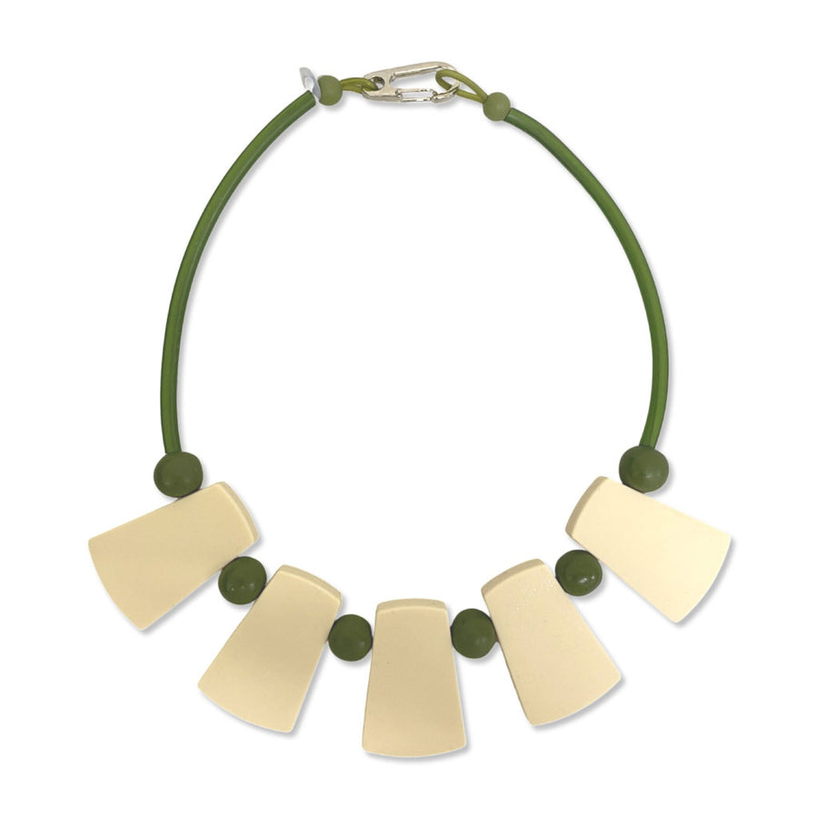 green and cream warrior necklace on a white background