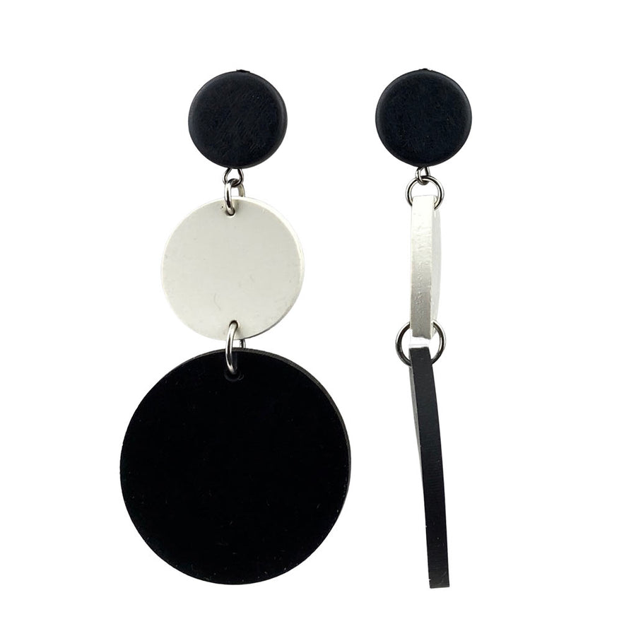 side view, cream and black rubber earrings