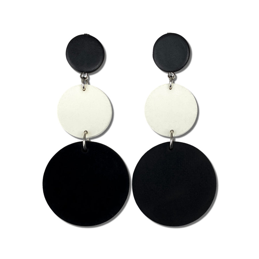 cream and black rubber earrings