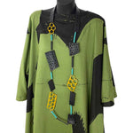 Recycled rubber necklace with hole details in yellow, teal and black