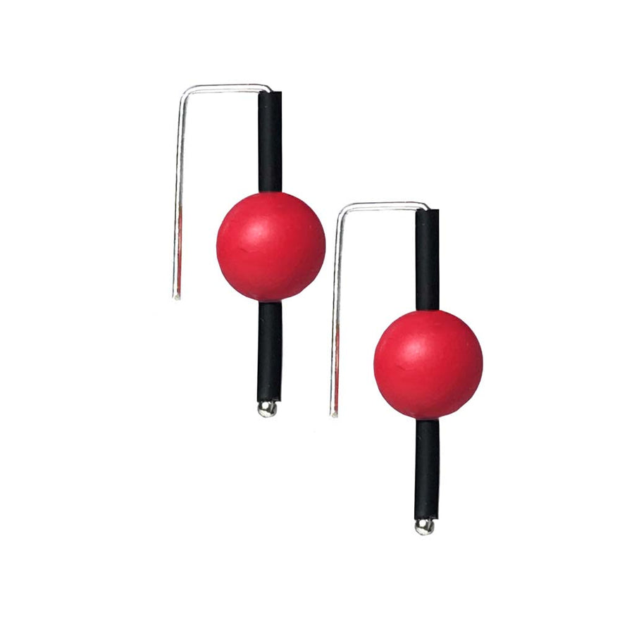 Red rubber earrings made with sterling silver. Bold, fun design.