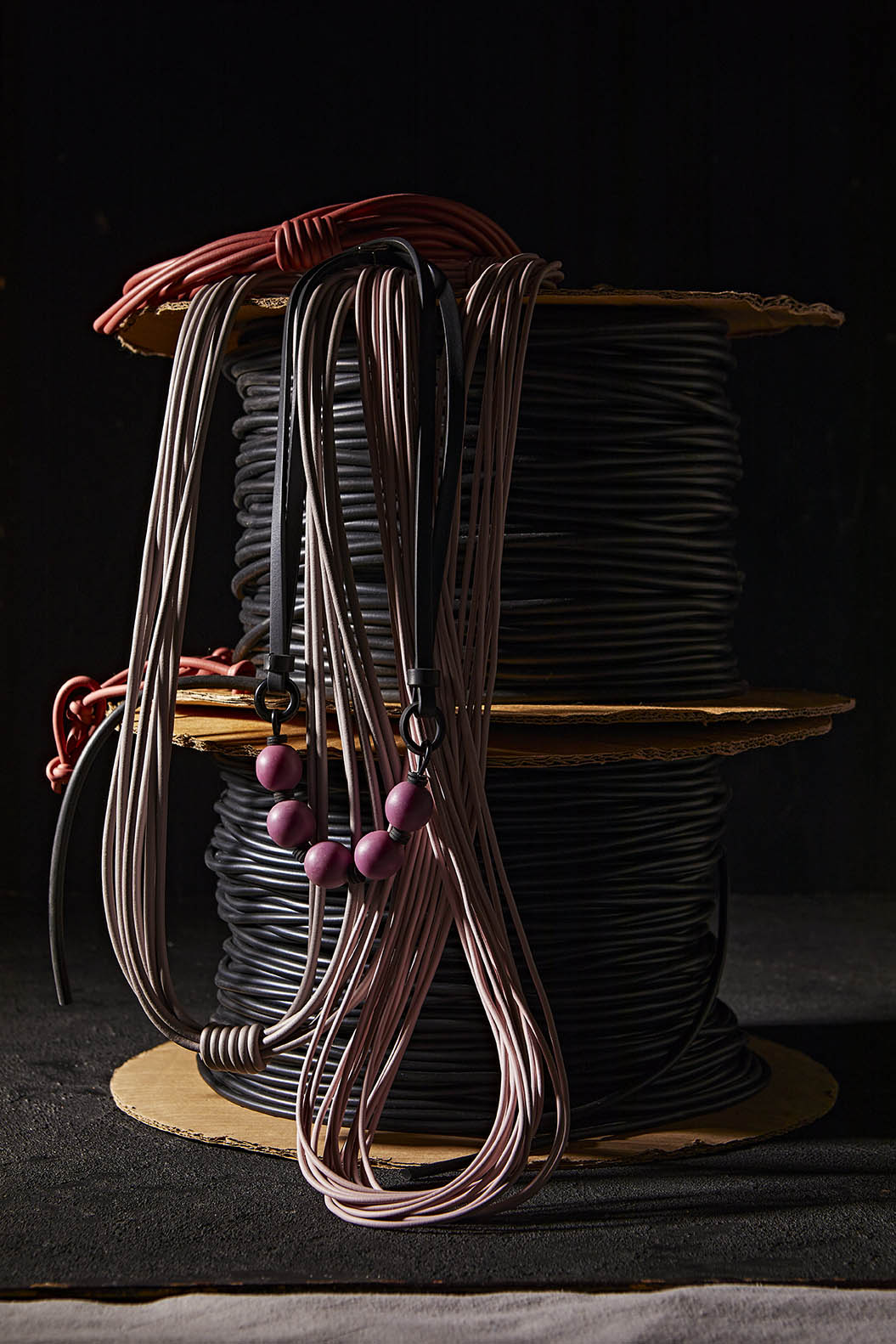 A styled photo of Frank Ideas rubber jewellery and necklaces