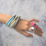 slim rubber, triple strand bangle with chrome