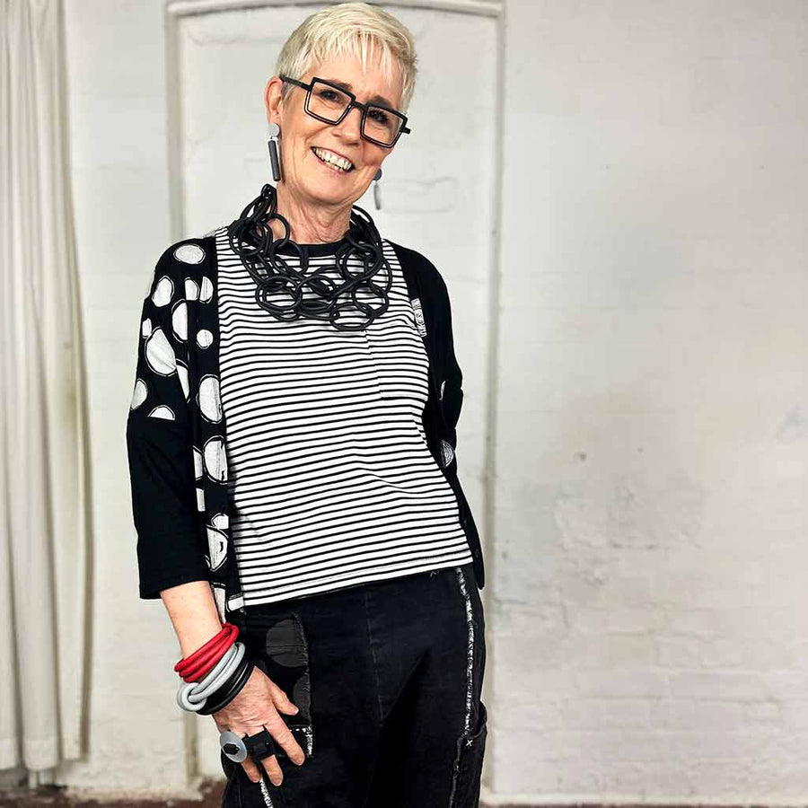 Rowan founder of Frank Ideas wearing the 3 strand rubber chain lightweight necklace. She is also wearing frank ideas earrings, bracelets and chunky ring