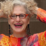 woman wearing a wooden pebble dangling earrings 