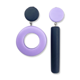 Asymmetrical blue and purple dot and dash earrings on a white background