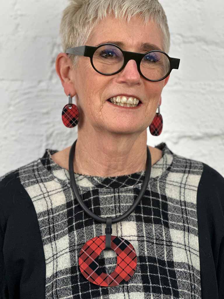 Model wearing red tartan perspex earrings and necklace for Frank Ideas