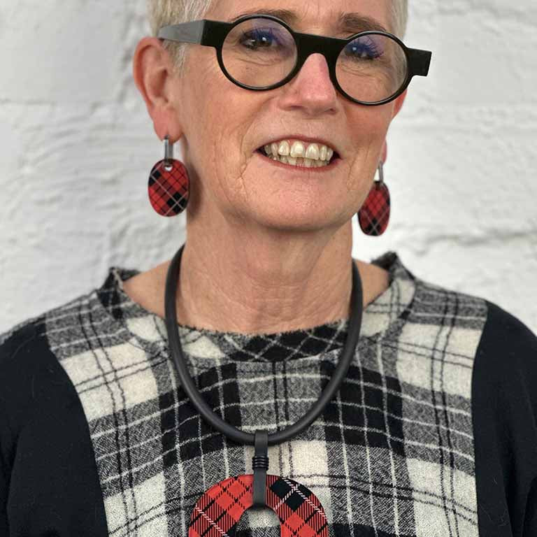 Model wearing red tartan perspex earrings and necklace for Frank Ideas