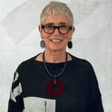 Rowan wearing reversible perspex O necklace and perspex earrings for Frank Idea