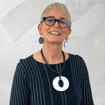 Rowan wearing reversible white/black perspex earrings and necklace for Frank Ideas