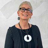 Rowan wearing reversible white/black perspex earrings and necklace for Frank Ideas