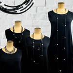 Long rubber and pearl necklace in black by Frank Ideas