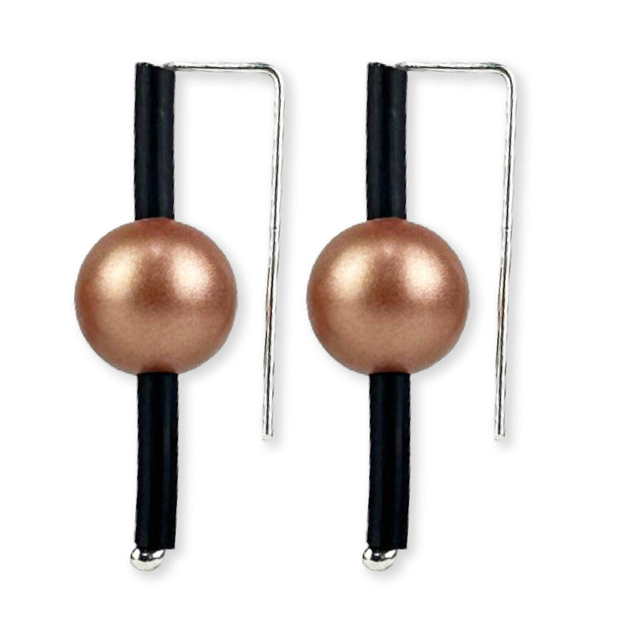 Compact drop earrings with rose gold bead and black rubber.
