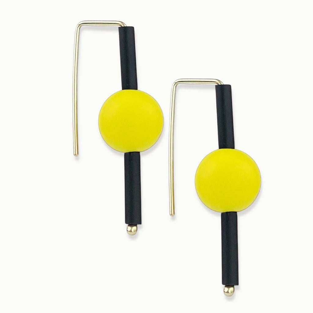 yellow rubber earrings made with sterling silver. Bold, fun design.