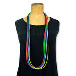 A long, multi-strand, primary-coloured rubber necklace by Frank Ideas