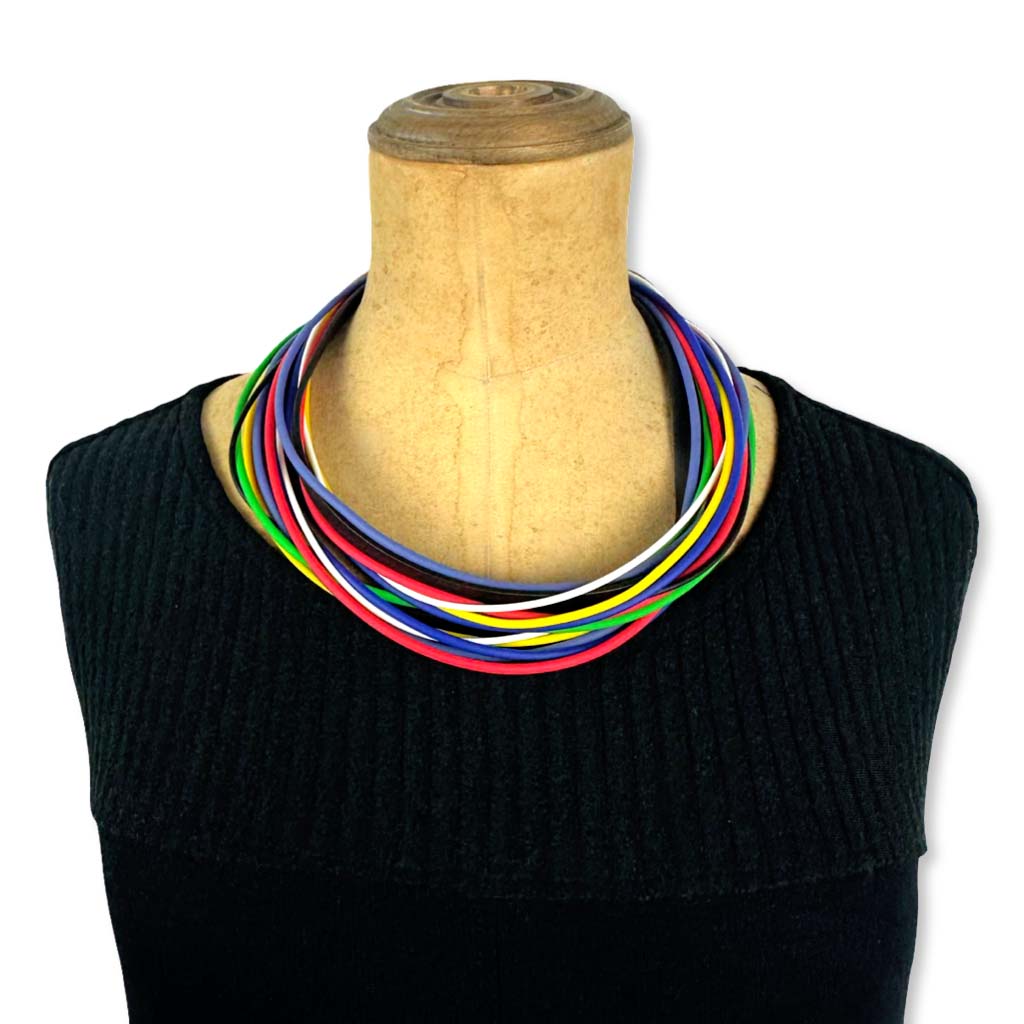 A multi-strand, primary-coloured rubber necklace by Frank Ideas