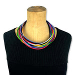 A multi-strand, primary-coloured rubber necklace by Frank Ideas
