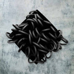 black rubber brooch with loops