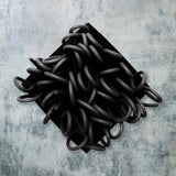 black rubber brooch with loops