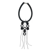 Quirky Lightweight black statement necklace on a white background
