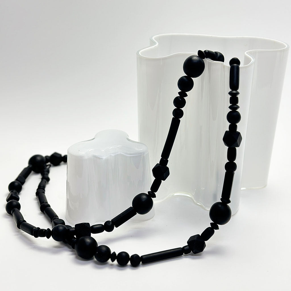 long black rubber bead necklace on Avar  Aalto vase