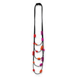 Multi strand necklace with red and. pink plastic beads on a mannequin
