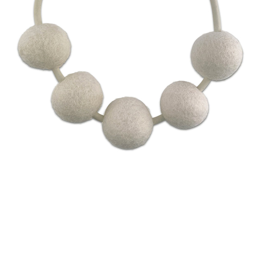 white 5 felt bead necklace on a white background