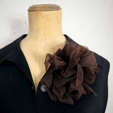 Fantasy Brooch in Brown Mesh worn on a black jacket – rubber and tulle statement brooch, handmade by Frank Ideas