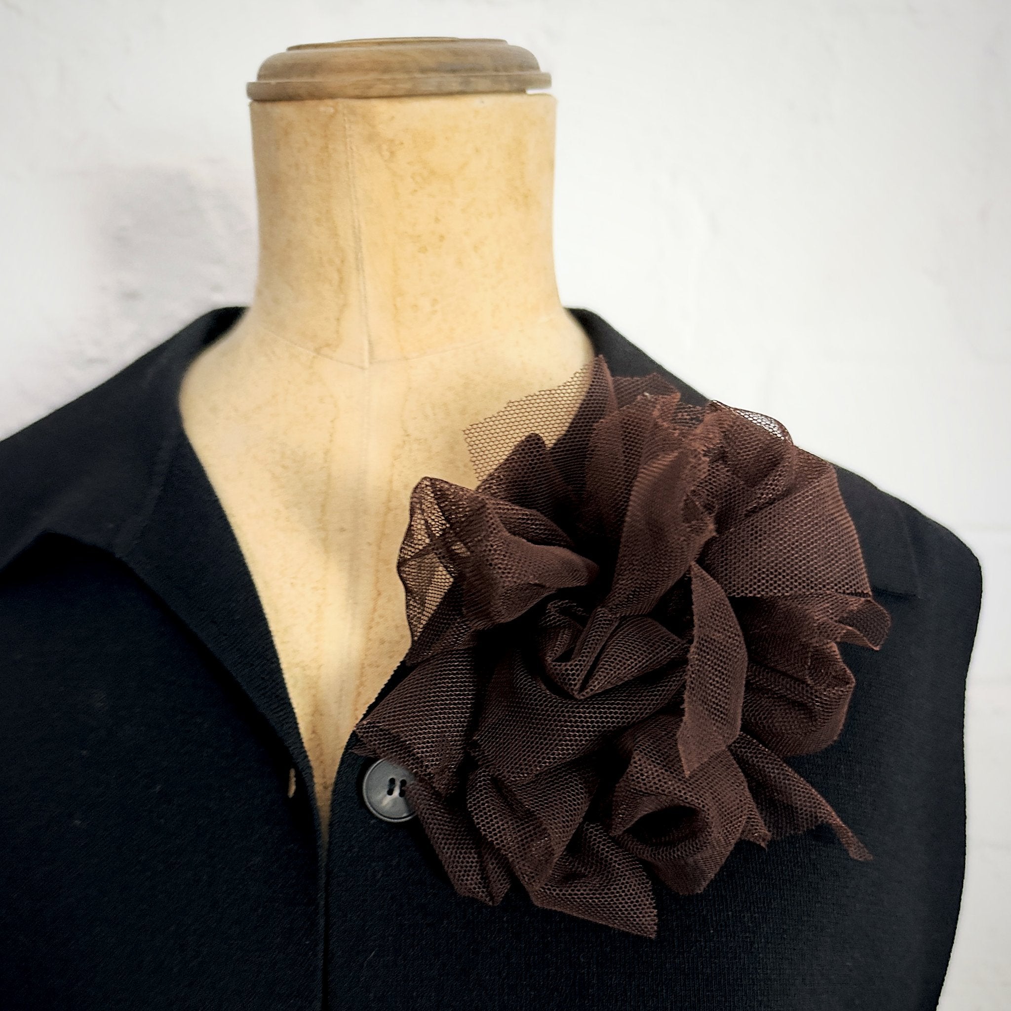 Fantasy Brooch in Brown Mesh worn on a black jacket – rubber and tulle statement brooch, handmade by Frank Ideas