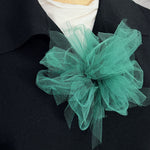 Fantasy Brooch in Green worn on a black jacket – rubber and tulle statement brooch, handmade by Frank Ideas