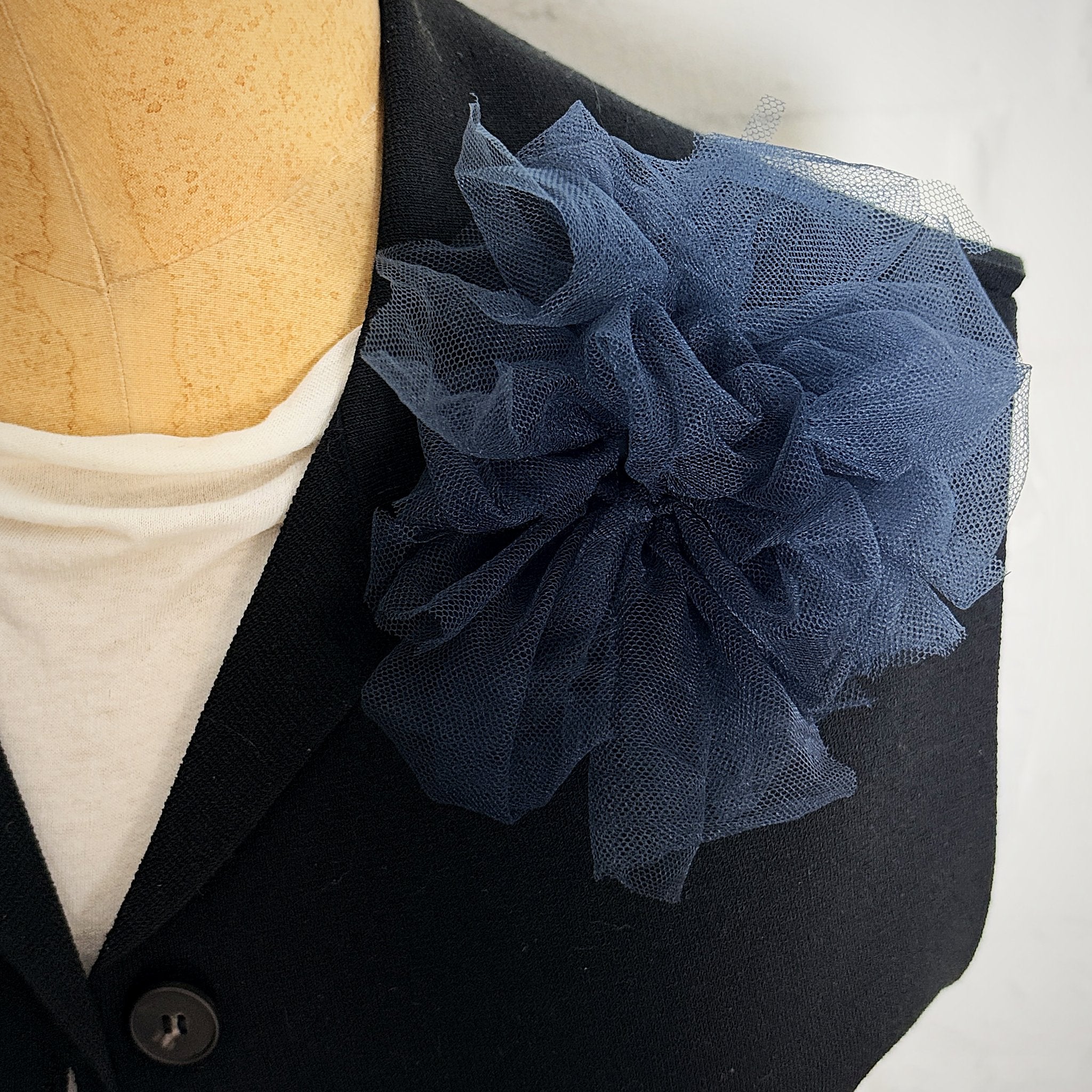 Fantasy Brooch in Midnight Teal worn on a black jacket – rubber and tulle statement brooch, handmade by Frank Ideas