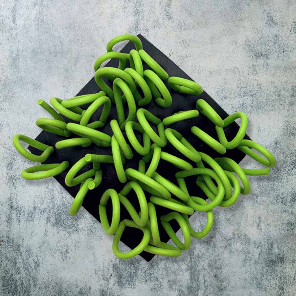 black and green rubber brooch with loops