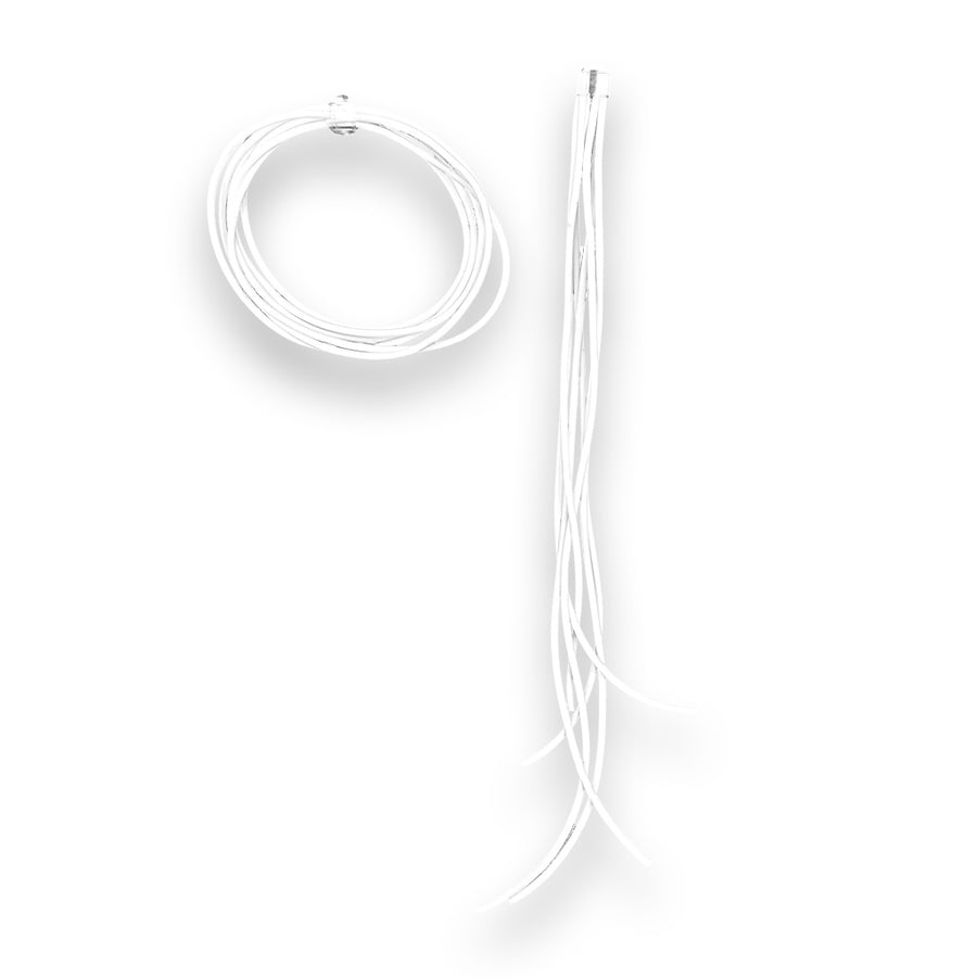 white asymmetric rubber earrings on a white background