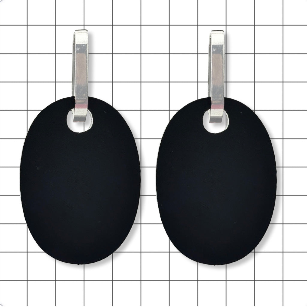 Reverse side of Perspex huggie earrings showing upcycled matte black finish by Frank Ideas