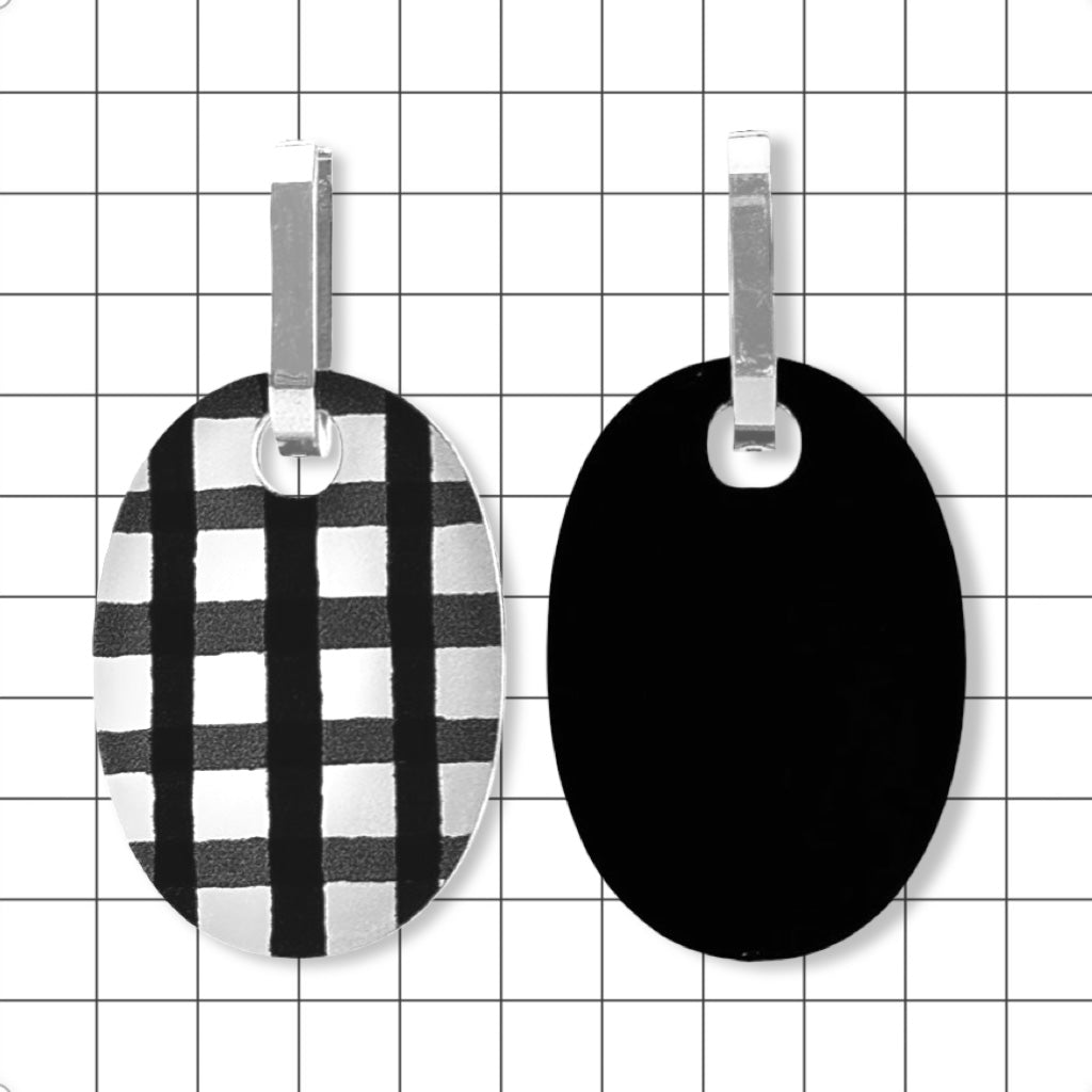 both sides of Perspex huggie earrings showing upcycled matte black finish and gloss gingham side, by Frank Ideas