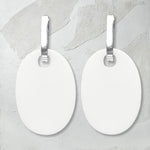 reversible white/black perspex earrings, white side. Frank Ideas