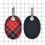 Both sides of Perspex huggie earrings showing upcycled matte black finish and glossy tartan side by Frank Ideas
