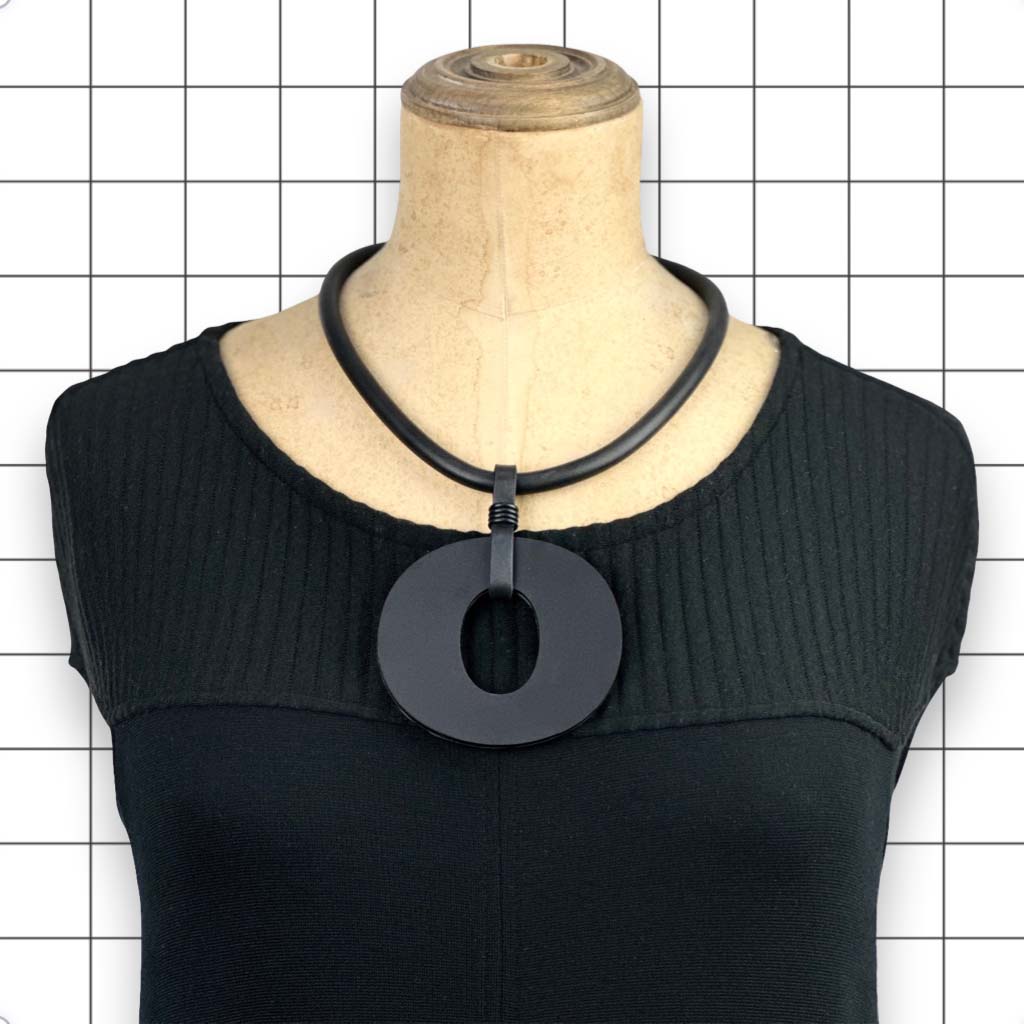 Reverse side of Perspex O necklace showing matte black finish by Frank Ideas
