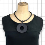 Reverse side of Perspex O necklace showing matte black finish by Frank Ideas